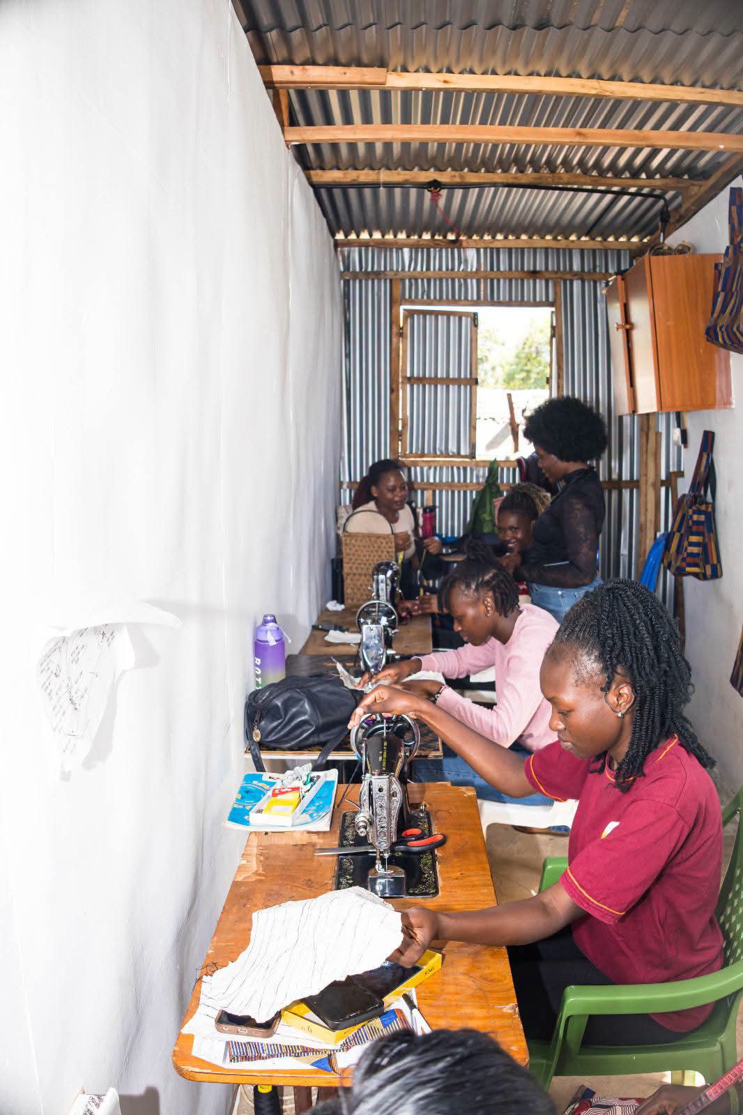 A teen mother training in temporary centre.